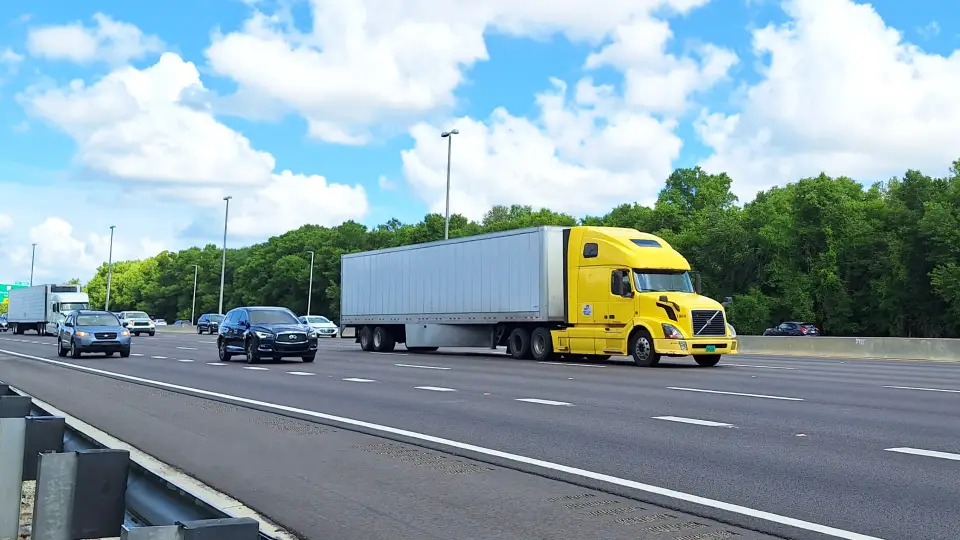Yellow semi truck driving on a highway in a Traffic Heaven highway sounds video